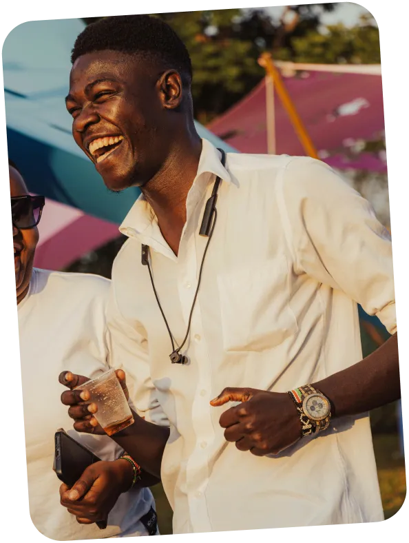 Friend laughing at an outdoor event